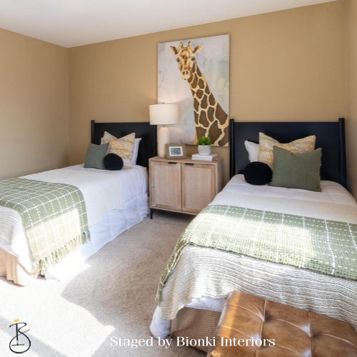 Luxury secondary bedroom staging featuring twin beds and coordinated bedding for family living. Staged by Bionki Interiors. Luxury secondary bedroom staging featuring twin beds and coordinated bedding for family living. Staged by Bionki Interiors.