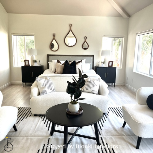 Luxury primary bedroom staging with symmetrical layout and thoughtfully layered bedding designed for buyer appeal. Staged by Bionki Interiors. Luxury primary bedroom staging with symmetrical layout and thoughtfully layered bedding designed for buyer appeal. Staged by Bionki Interiors.