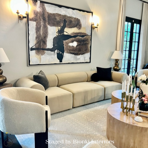 Luxury living room staging featuring sculptural seating, a soft neutral palette, and statement artwork designed for entertaining. Staged by Bionki Interiors. Luxury living room staging featuring sculptural seating, a soft neutral palette, and statement artwork designed for entertaining. Staged by Bionki Interiors.