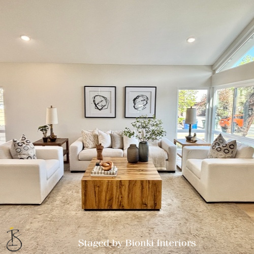 Luxury vacant home staging for a spacious living room with symmetrical seating and warm wood accents highlighting scale and flow. Staged by Bionki Interiors. Luxury vacant home staging for a spacious living room with symmetrical seating and warm wood accents highlighting scale and flow. Staged by Bionki Interiors.