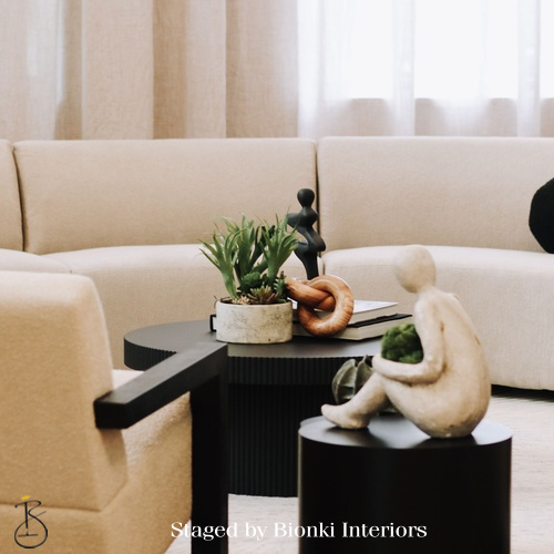 Luxury living room detail styling featuring sculptural accessories, layered textures, and soft neutral upholstery designed to add warmth and visual interest. Styled by Bionki Interiors. Luxury living room detail styling featuring sculptural accessories, layered textures, and soft neutral upholstery designed to add warmth and visual interest. Styled by Bionki Interiors.