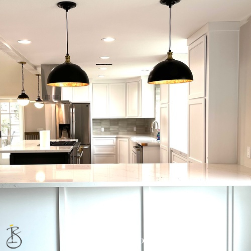 Custom kitchen design featuring a bright, open layout and clean-lined cabinetry. Designed by Bionki Interiors.