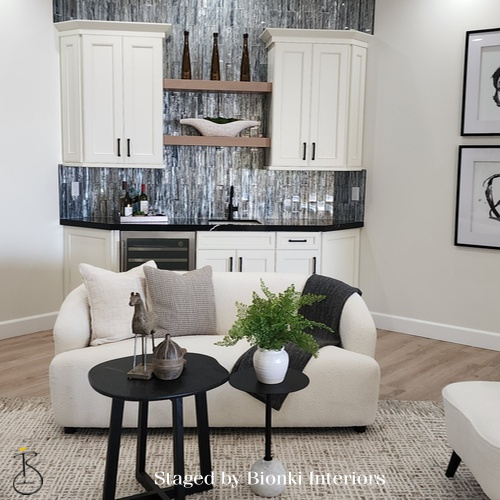 Luxury open-concept living and kitchen staging featuring cohesive furniture placement and layered textures. Staged by Bionki Interiors. Luxury open-concept living and kitchen staging featuring cohesive furniture placement and layered textures. Staged by Bionki Interiors.