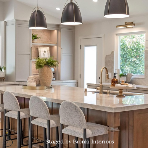 Luxury kitchen staging featuring a statement island and sculptural pendant lighting. Staged by Bionki Interiors. Luxury kitchen staging featuring a statement island and sculptural pendant lighting. Staged by Bionki Interiors.