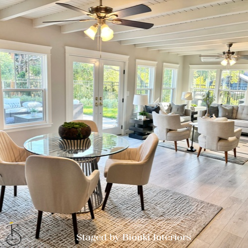 Luxury open-concept living and dining staging with seamless indoor-outdoor flow. Staged by Bionki Interiors. Luxury open-concept living and dining staging with seamless indoor-outdoor flow. Staged by Bionki Interiors.
